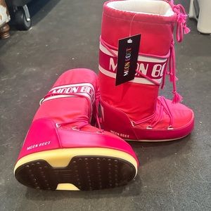 Brand new Moon Boots with tags. Pink. Tag size 7/8.5.
